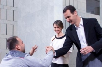 الرئيس الأسد والسيدة أسماء يستقبلان عدداً من جرحى الجيش العربي السوري  بمناسبة عيد الأم